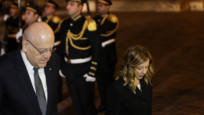 Lebanon's caretaker Prime Minister Najib Mikati receives his Italian counterpart Giorgia Meloni at the Government Palace in Beirut