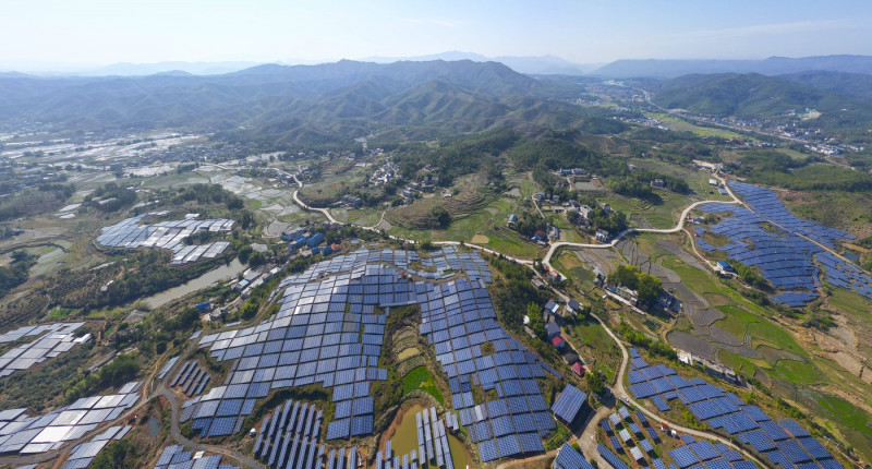 GANZHOU, CHINA - MARCH 12: Aerial view of arrays of solar panels at a photovoltaic power station on March 12, 2024 in Hu