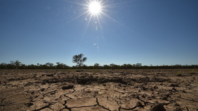the sun scorches an already cracked earth on a farm in the Australian agricultural town of Walgett