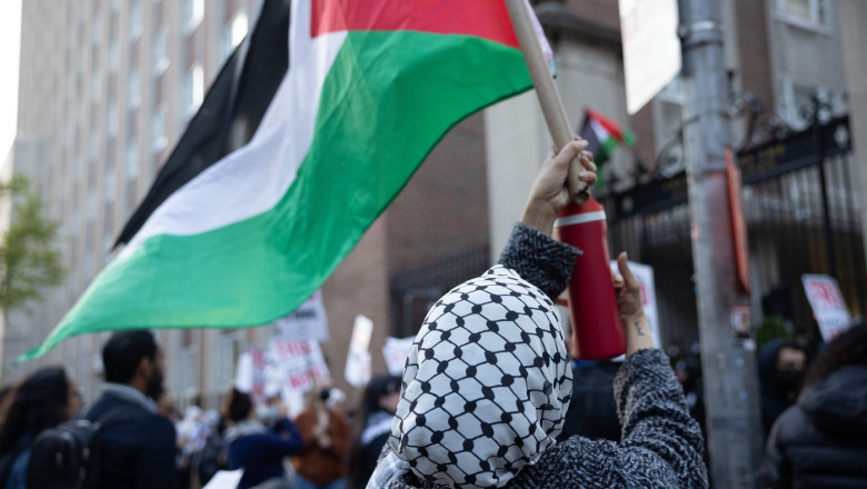 Pro-Palestine demonstrators are gathering in protest both inside and outside the locked gates of the Columbia University campus in New York City