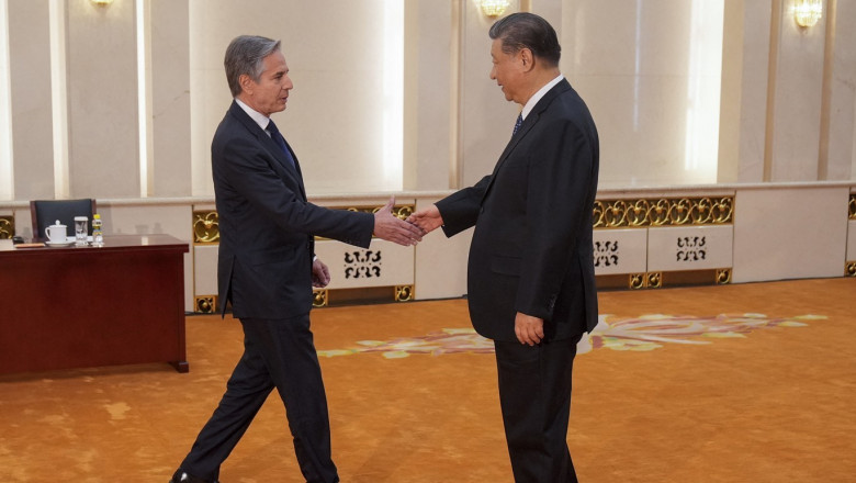 US Secretary of State Antony Blinken (L) shakes hands with China's President Xi Jinping at the Great Hall of the People in Beijing