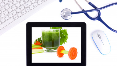 healthy eating:keyboard and Digital Tablet with stethoscope isolated