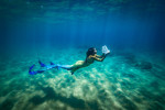 Professional mermaid makes $8k-an-hour - despite being scared of the ocean.