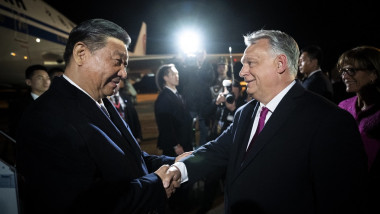 Chinese President Xi Jinping (L) is greeted by Hungarian Prime Minister Viktor Orban as he arrives at Liszt Ferenc Budapest airport