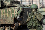 Moscow, Russia. 30th of April, 2024. Russian soldiers guard an area with armoured military vehicles that belonged to the Ukrainian army on display at the Victory park WWII memorial complex in Moscow, Russia. The Russian military put some of the equipment