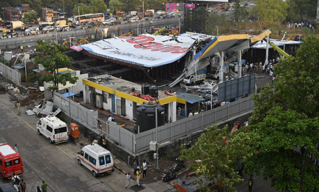 MUMBAI, INDIA - MAY 13: Ongoing rescue operation held by Mumbai Fire Brigade, NDRF, Mumbai Police and BMC at site after