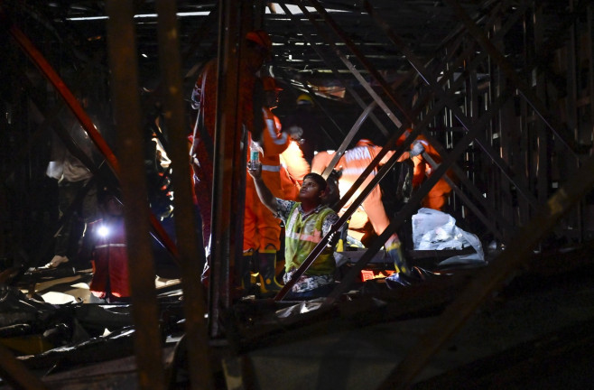 MUMBAI, INDIA - MAY 13: Ongoing rescue operation held by Mumbai Fire Brigade, NDRF, Mumbai Police and BMC at site after