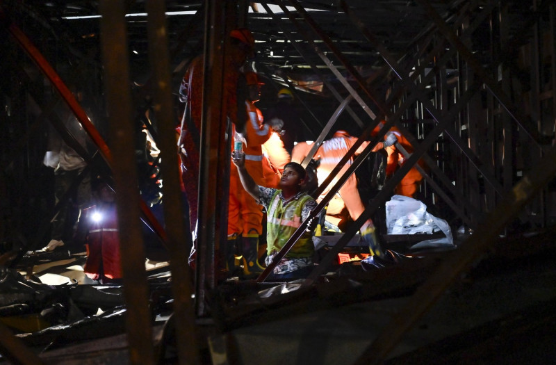 MUMBAI, INDIA - MAY 13: Ongoing rescue operation held by Mumbai Fire Brigade, NDRF, Mumbai Police and BMC at site after