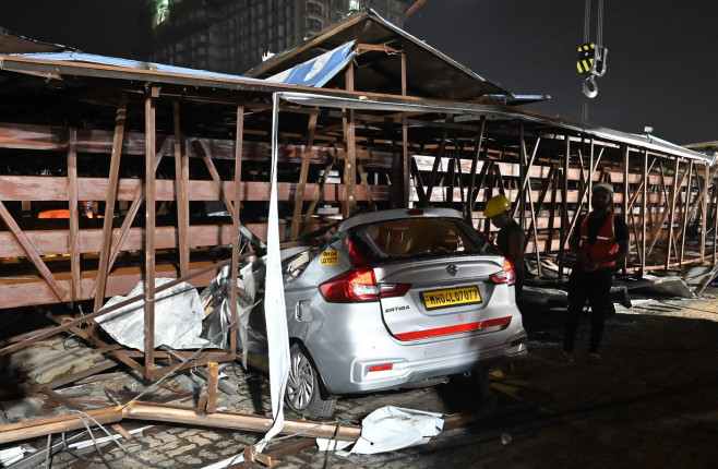 MUMBAI, INDIA - MAY 13: Ongoing rescue operation held by Mumbai Fire Brigade, NDRF, Mumbai Police and BMC at site after