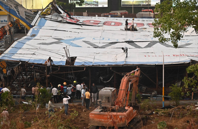 MUMBAI, INDIA - MAY 13: Ongoing rescue operation held by Mumbai Fire Brigade, NDRF, Mumbai Police and BMC at site after