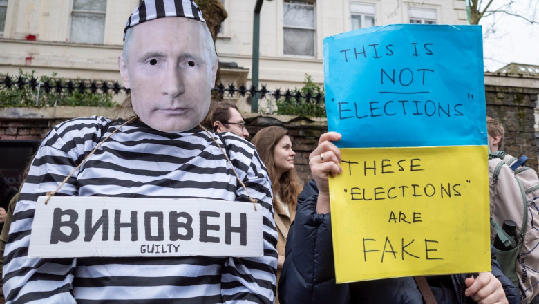 Handcuffed Putin outside Embassy of Russia on Russian polling day, Notting Hill, London, UK - 17 Mar 2024