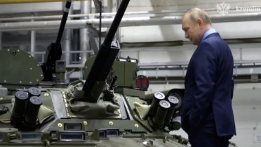 Putin climbs a tank