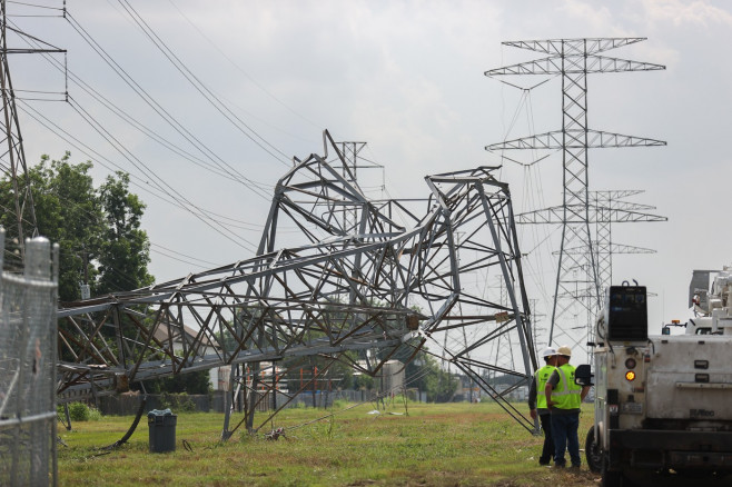 Electrical Crews Work To Restore Power To Houston Residents After Deadly Storm