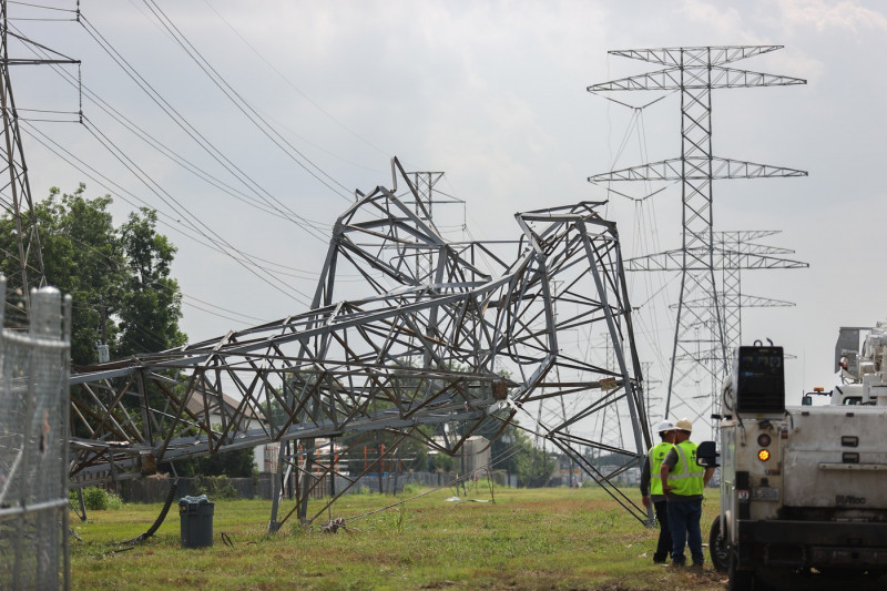 Electrical Crews Work To Restore Power To Houston Residents After Deadly Storm