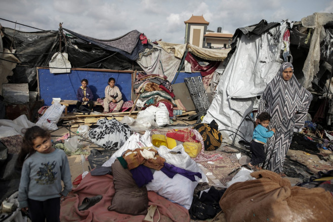 Israeli shelling killed at least 21 Palestinians, including children, Palestinians mourn