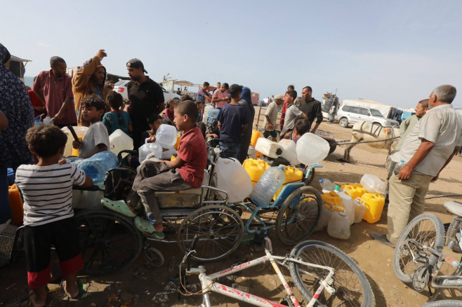 Palestinians, including children, who migrated from Rafah to Deir al-Balah due to Israeli attacks