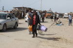 Palestinians, including children, who migrated from Rafah to Deir al-Balah due to Israeli attacks