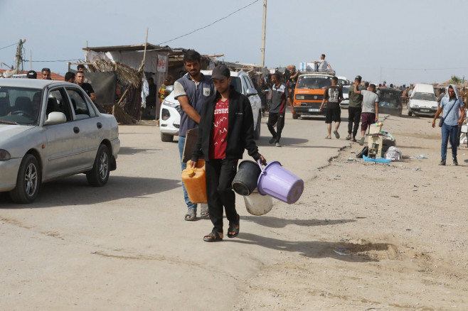 Palestinians, including children, who migrated from Rafah to Deir al-Balah due to Israeli attacks