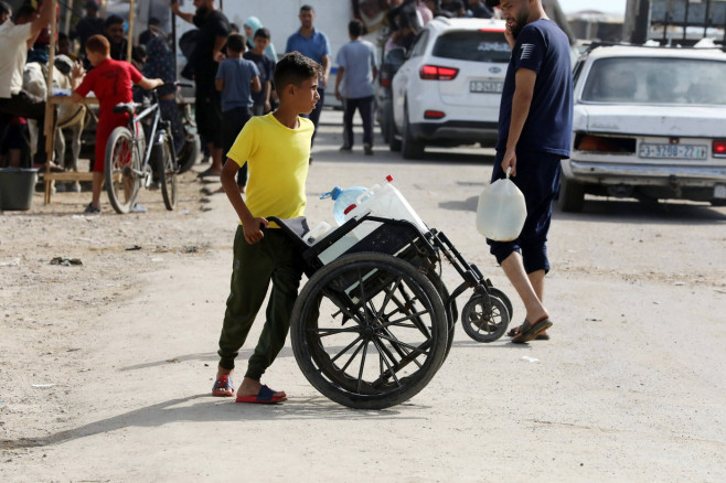 Palestinians, including children, who migrated from Rafah to Deir al-Balah due to Israeli attacks