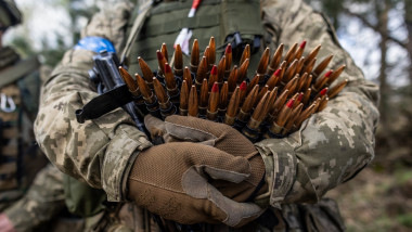 A Ukrainian soldier holds machine gun munition during a military training