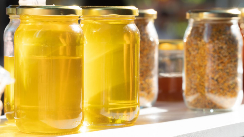 Glass jars with honey and propolis, canned food