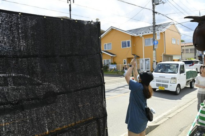 A black screen built to dissuade tourists from taking photos of Mount Fuji in Japan