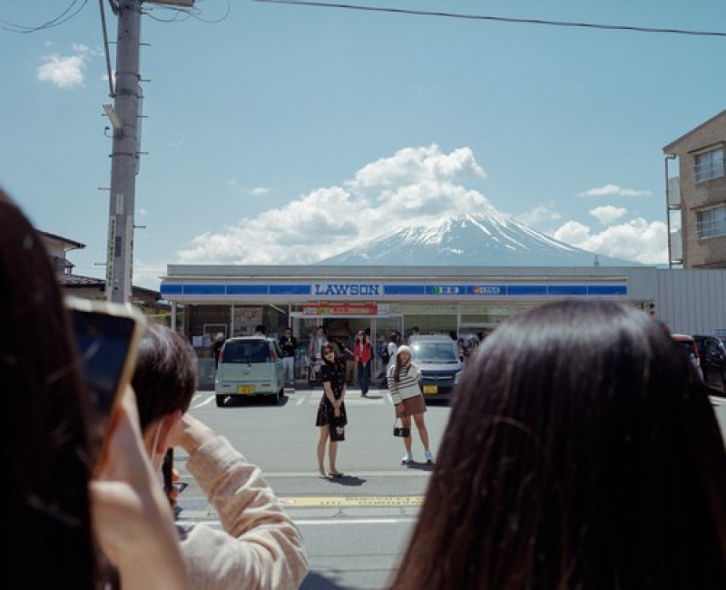 Japan, over tourism at convenience store with Mount Fuji