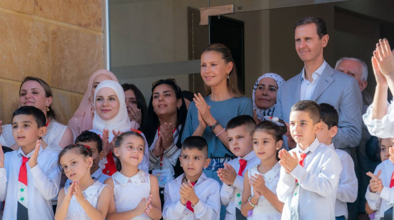 Syria's President Bashar al-Assad and First Lady Asma al-Assad eet with students of Dar Al-Aman School for the Children of Martyrs