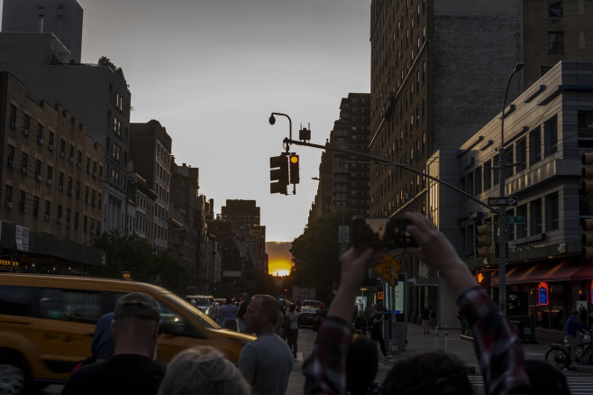 Another astronimical event in New York Astronomy aficionados risk life and limb as they stand in West 23rd street in Che