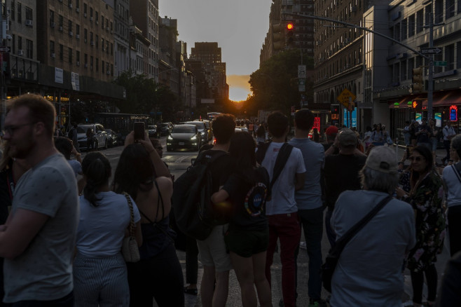 Another astronimical event in New York Astronomy aficionados risk life and limb as they stand in West 23rd street in Che