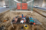 GURUGRAM, INDIA - MAY 29: Construction workers take rest during the lunch break under a flyover on a hot summer day at D