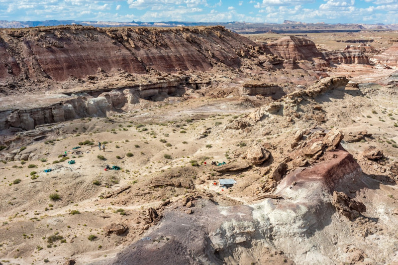 Paleontologists work in the Morrison Formation in the Burpee Dinosaur Quarry in the Caineville Desert near Hanksville, Utah.