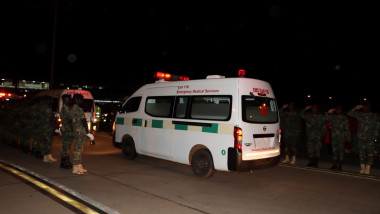 An ambulance carrying the remains of Malawian Vice President Saulos Chilima is seen at Kamuzu International Airport in Lilongwe
