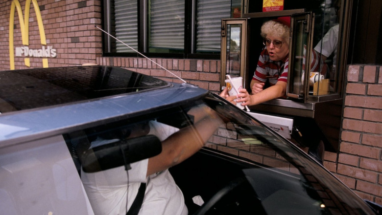 Buying a milk shake at a drive through thru macdonalds restaurant iowa usa