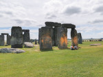 Stonehenge covered in orange paint by Just Stop Oil