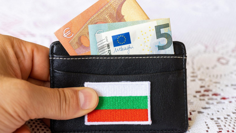 Wallet with protruding euro banknotes and the symbol of Bulgaria, The concept of currency change and Bulgaria's willingness to join the Euro zone