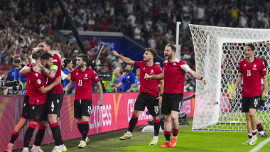 Georgien players celebrate after winning the UEFA EURO 2024 group stage match between Georgia and Portugal