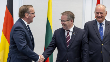 German defense minister Boris Pistorius (L) shakes hands with Norwegian defense minister Björn Arild Gram following the