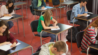 Students taking an exam in classroom