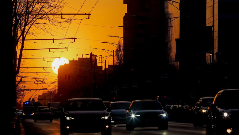 Bucharest, Romania - March 22, 2022: Cars in traffic at rush hour on a boulevard in Bucharest.