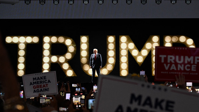 US former President and 2024 Republican presidential candidate Donald Trump arrives onstage to speak during the last day of the 2024 Republican National Convention at the Fiserv Forum in Milwaukee, Wisconsin,