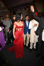 *EXCLUSIVE* Kim Kardashian Dazzles in Ruby Red as She Attends Anant Ambani's Star-Studded Wedding