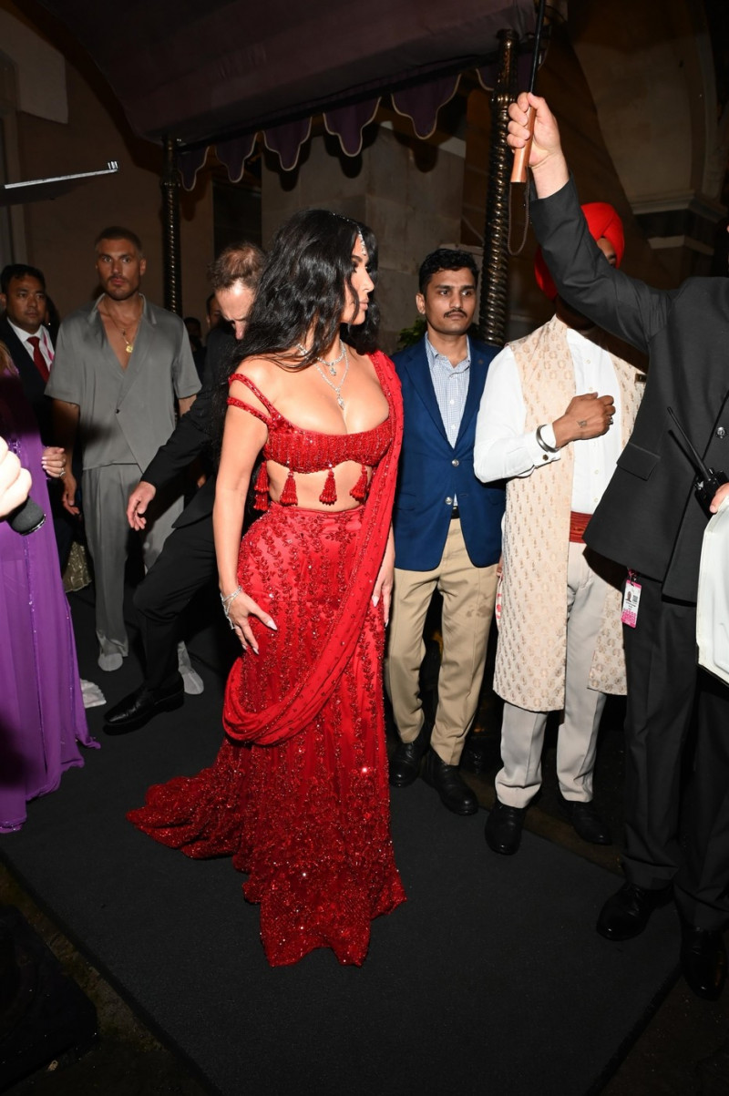 *EXCLUSIVE* Kim Kardashian Dazzles in Ruby Red as She Attends Anant Ambani's Star-Studded Wedding