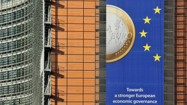 Banner about the euro hanging from building of the European Commission, executive body of European Union in Brussels, Belgium