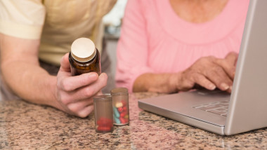 Senior couple looking up medication online