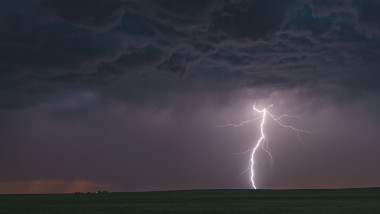 Forked cloud-to-ground lightning bolt hits rural terrain, Ogallala, Nebraska, US