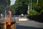 Bangladesh police personnel fire tear shells as students protest against quotas in government jobs at Dhaka University in the capital on July 17, 2024