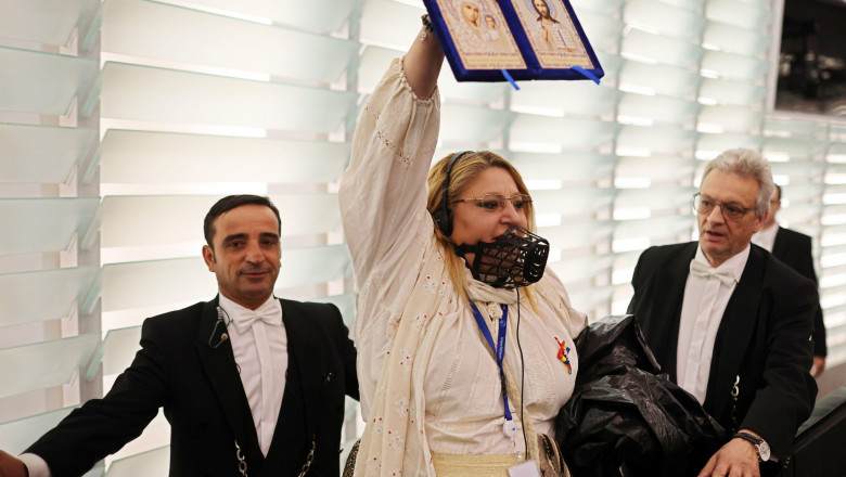 18 July 2024, France, Straburg: Diana Iovanovici Sosoaca (M), Member of the European Parliament from Romania, is led out of the chamber during the plenary session of the European Parliament. The EU Parliament is voting on a second term of office for EU Co