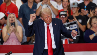 Former US President and 2024 Republican presidential candidate Donald Trump dances after speaking during a campaign rally at Herb Brooks National Hockey Center in Saint Cloud, Minnesota