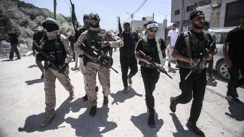 Palestinian gunmen from the Izz al-Din al-Qassam Brigades, affiliated with the Islamic Resistance Movement Hamas